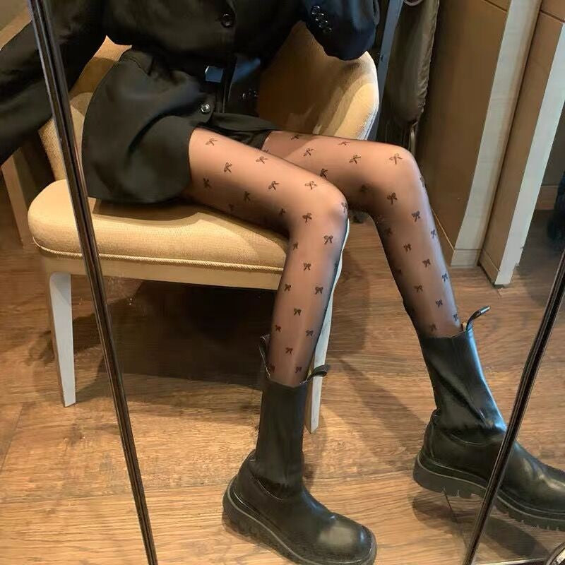 Guangzhou Baihui women's fishing net socks anti-hook silk thin love black silk long one-in-one socks European and American jk pantyhose wholesale